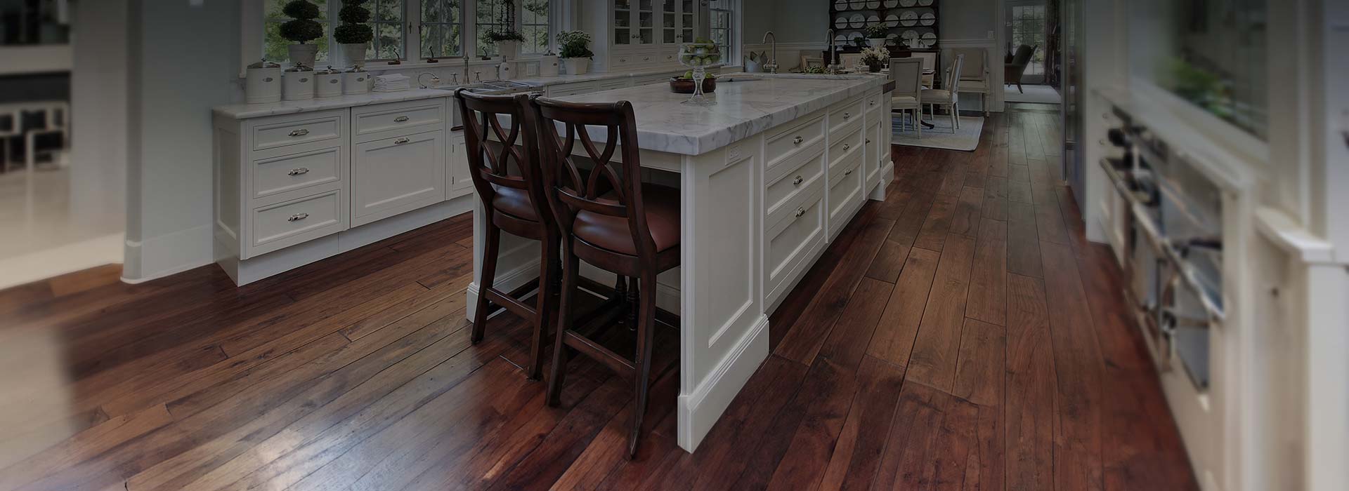 Kitchen with expert installed hardwood flooring.