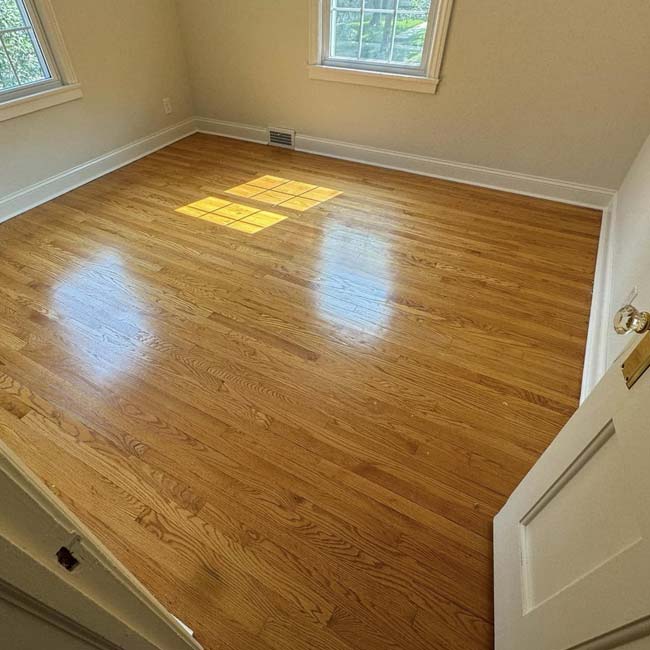 Sunlit room with hardwood floors, ideal for new Hardwood Floor Installation by All American Flooring.